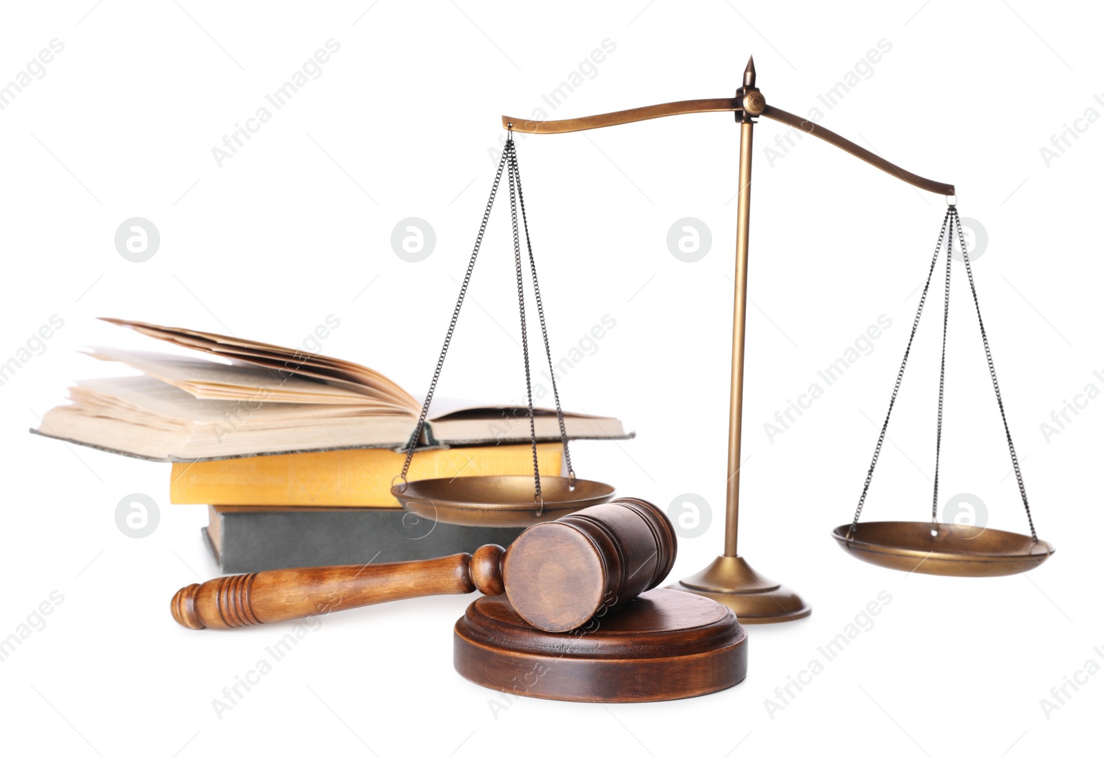 Photo of Wooden gavel, books and scales of justice on white background