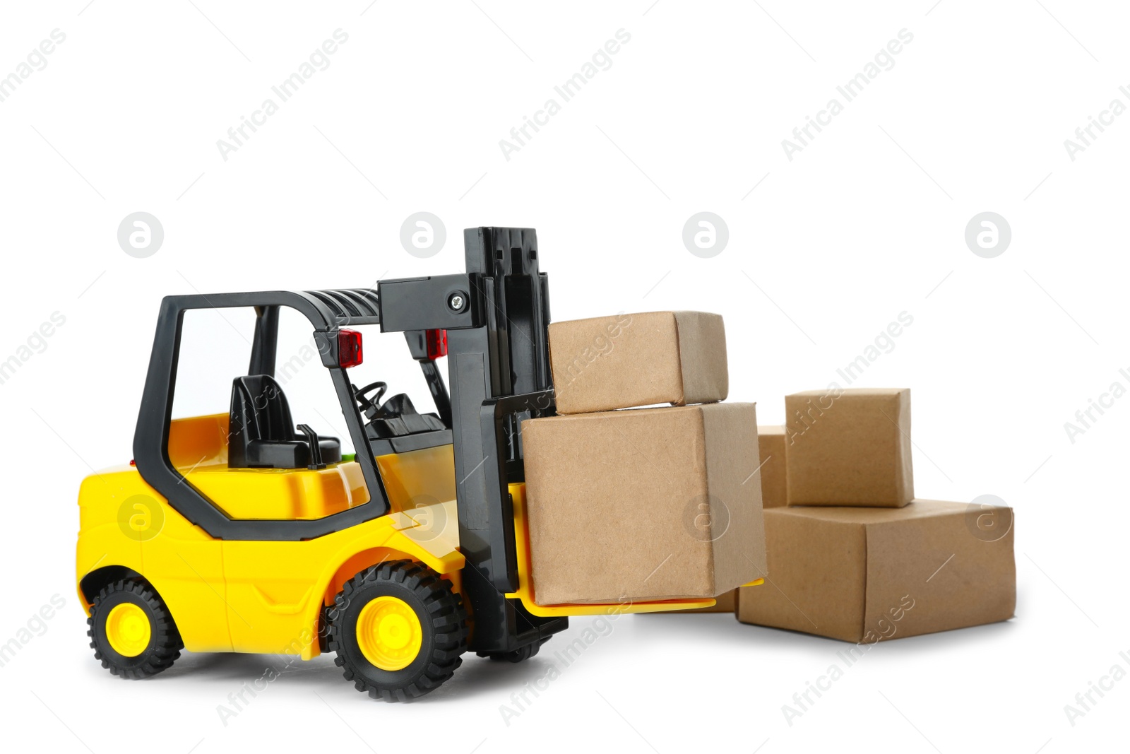 Photo of Toy forklift with boxes isolated on white. Logistics and wholesale concept