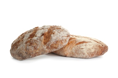 Photo of Loaves of delicious fresh bread on white background
