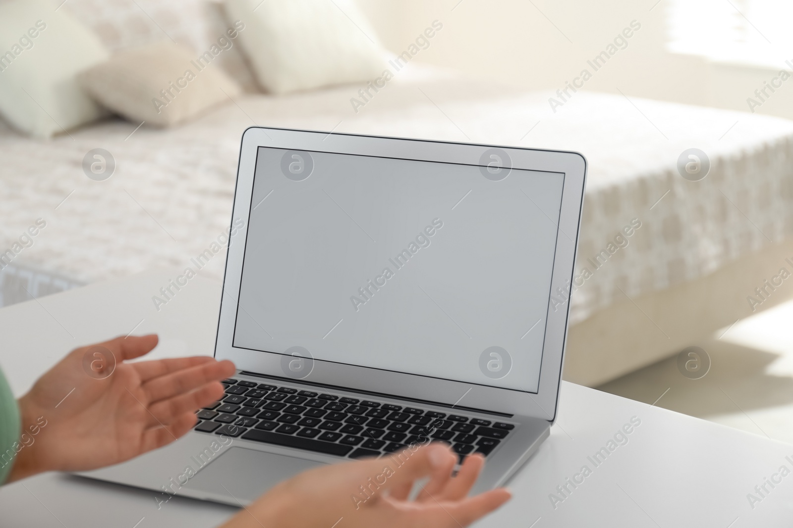 Photo of Coworkers working together online. Young woman using video chat on laptop, closeup