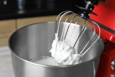 Photo of Modern stand mixer indoors, closeup. Home appliance