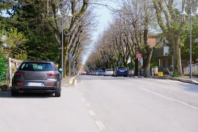 Beautiful view of city street traffic with cars on sunny day