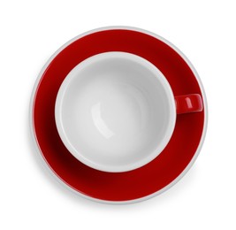 Photo of Red ceramic cup with saucer isolated on white