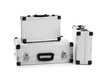 Set of modern suitcases on white background