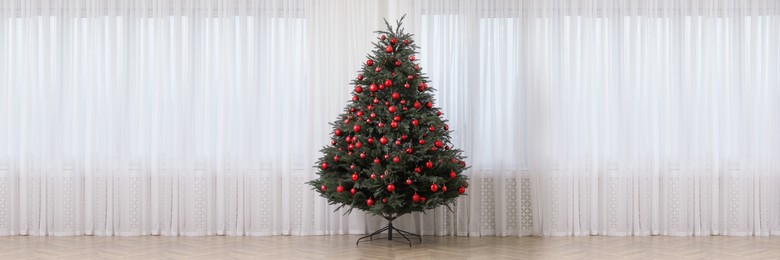 Image of Beautifully decorated Christmas tree indoors. Banner design