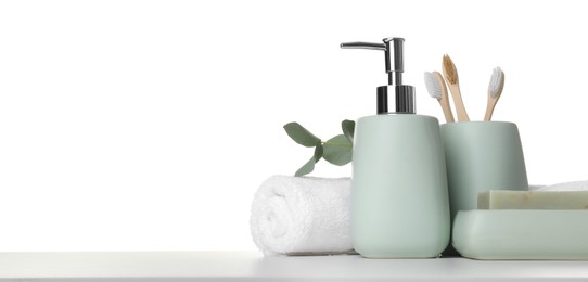 Bath accessories. Different personal care products and eucalyptus branch on table against white background. Space for text