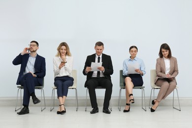 Photo of People waiting for job interview in office hall