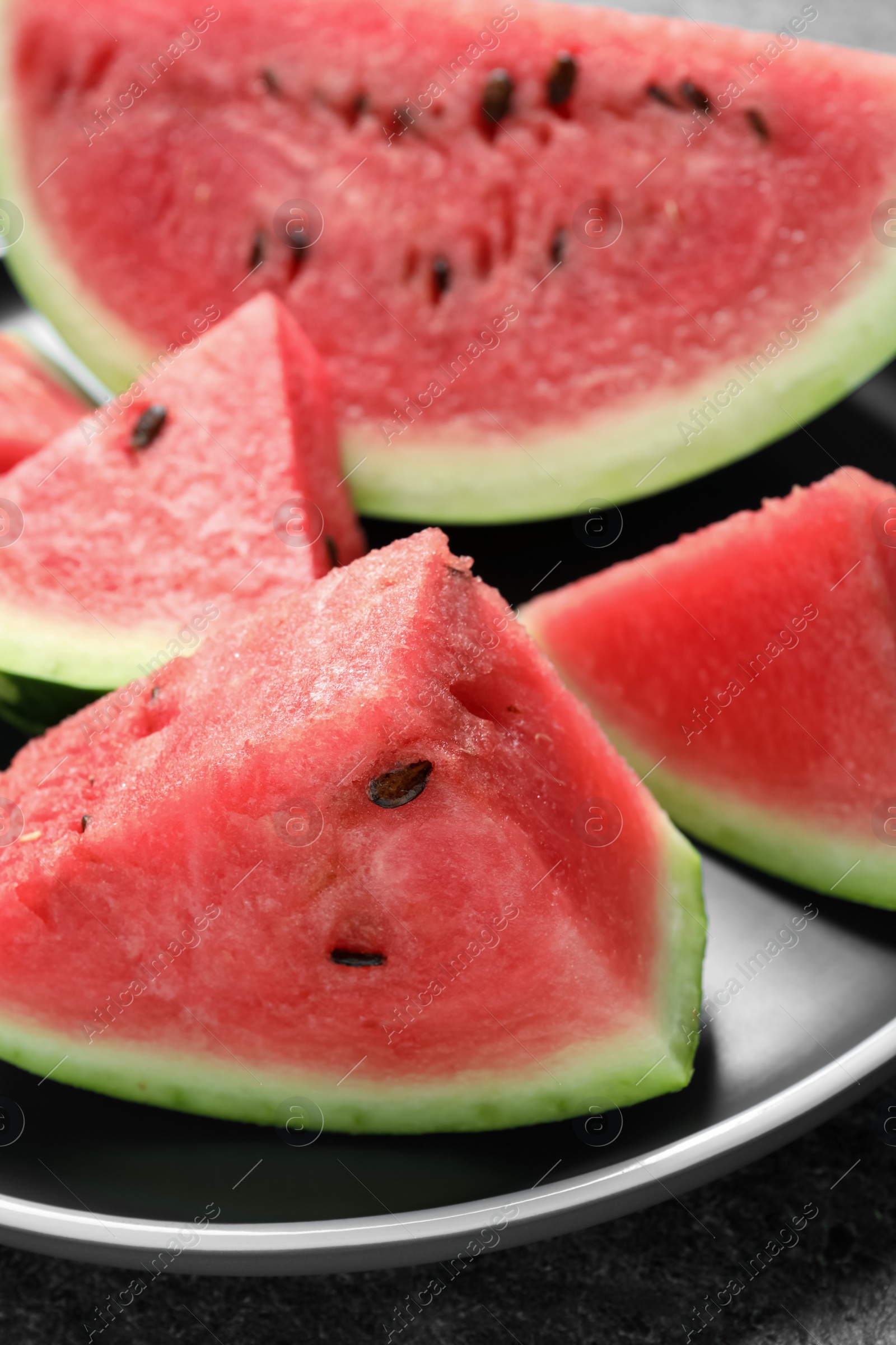 Photo of Delicious fresh watermelon slices on plate, closeup