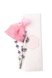 Photo of Scented sachets and dried lavender on white background, top view