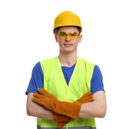Young man with crossed arms wearing safety equipment on white background