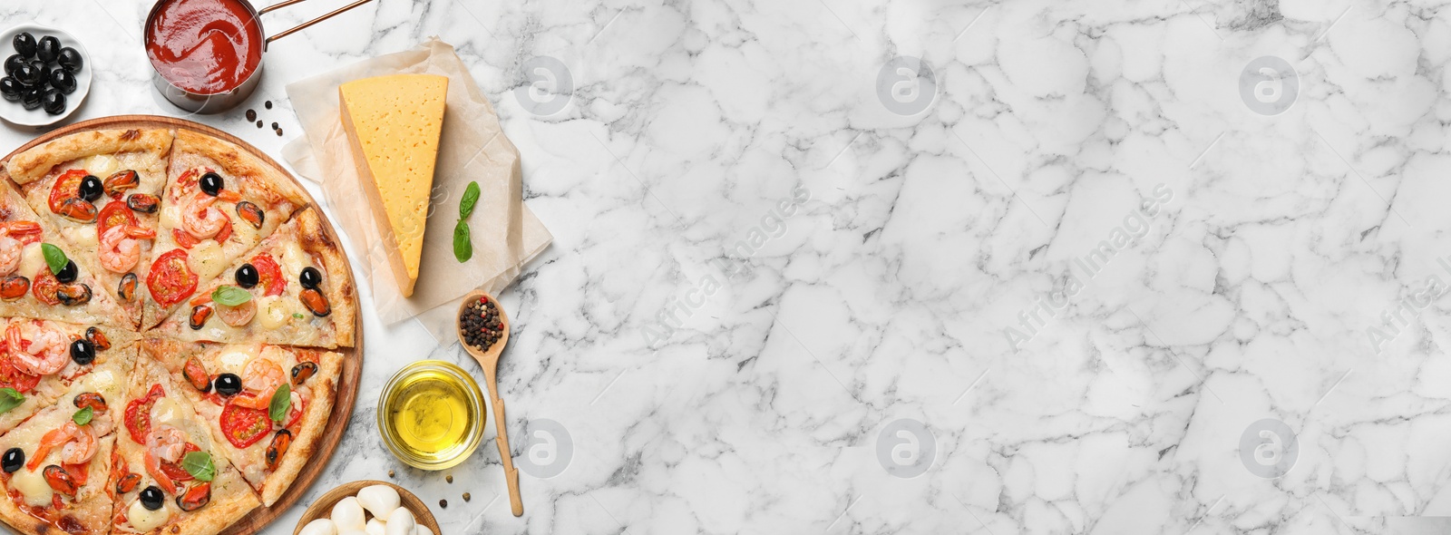 Image of Tasty seafood pizza and ingredients on white marble table, flat lay with space for text. Banner design