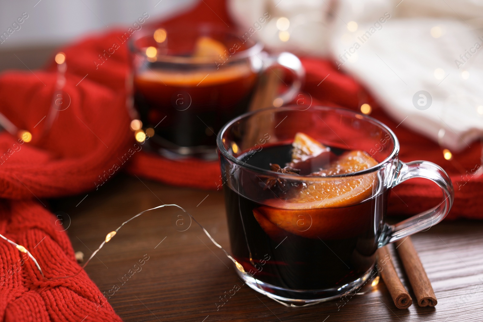 Photo of Beautiful composition with cup of mulled wine on table. Space for text