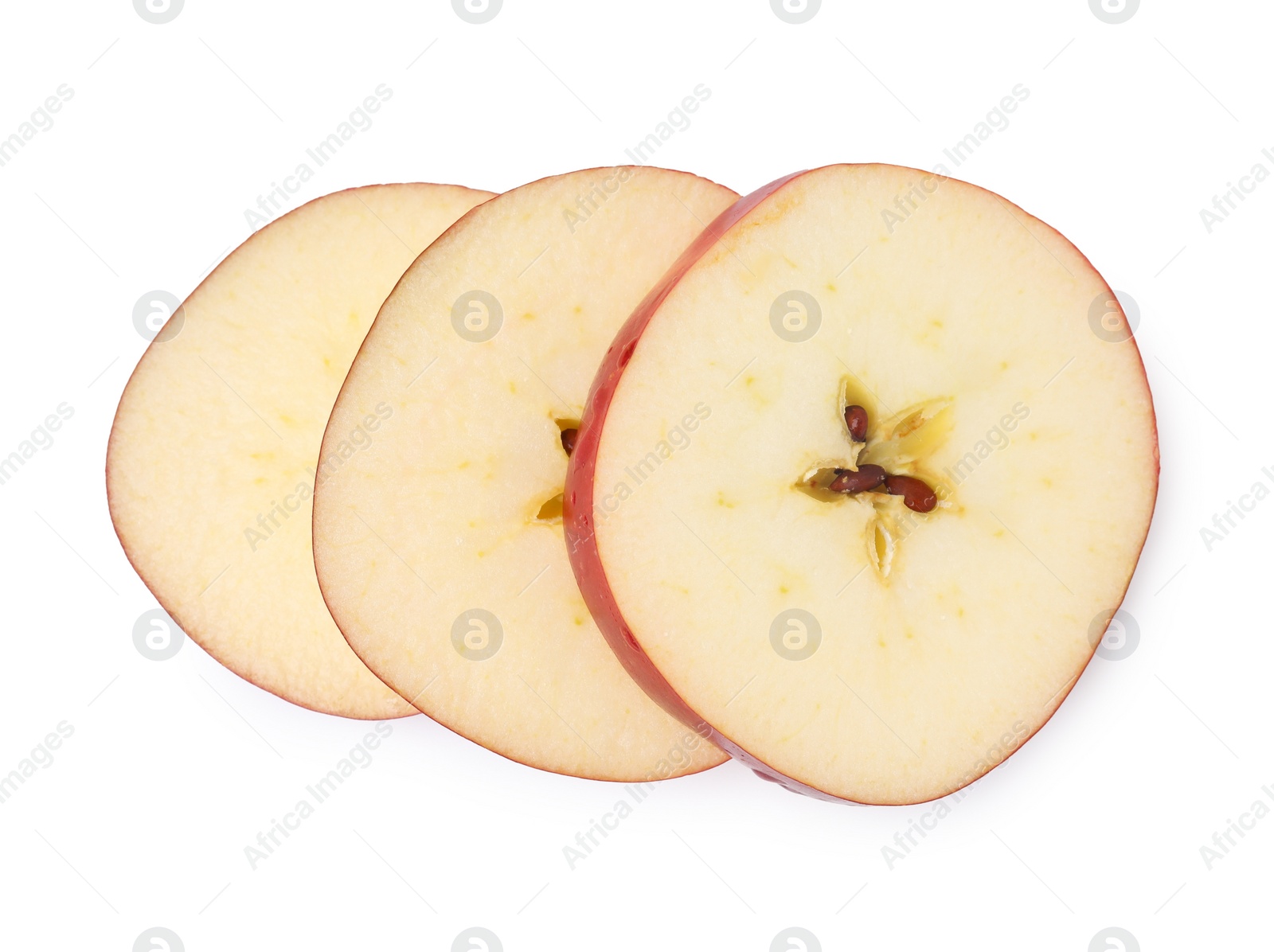 Photo of Slices of ripe red apple isolated on white, top view