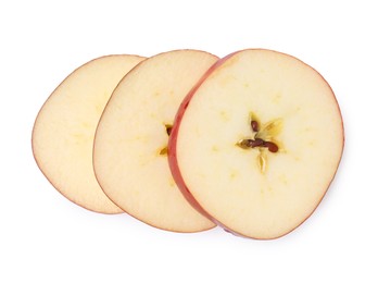 Photo of Slices of ripe red apple isolated on white, top view