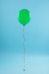 Bright balloon on color background. Celebration time