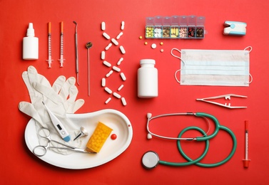 Photo of Flat lay composition with medical objects on color background