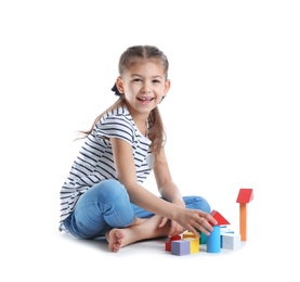 Photo of Cute child playing with colorful blocks on white background