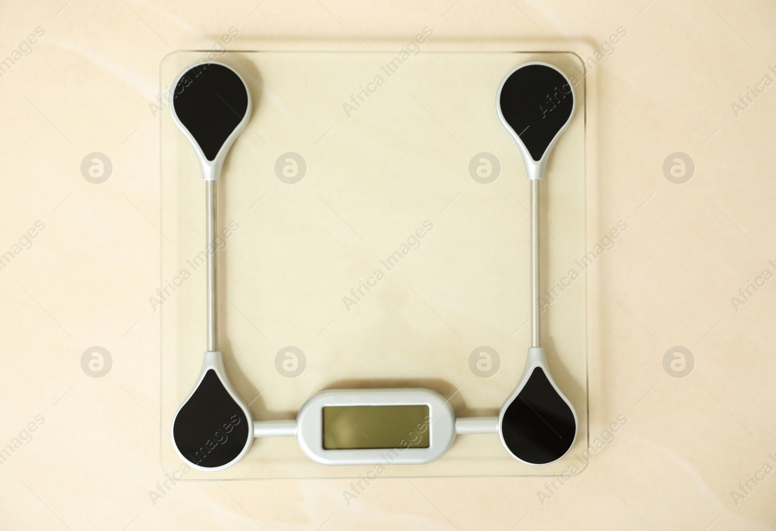 Photo of Scales on floor, top view. Overweight problem