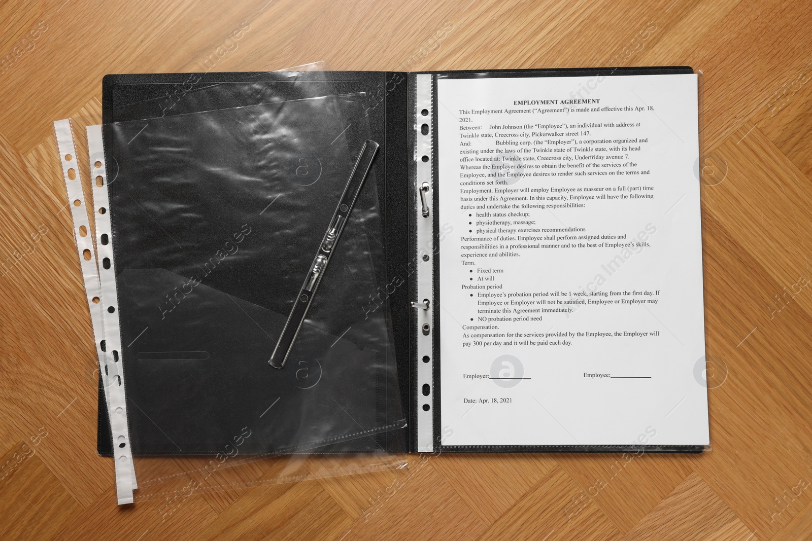 Photo of File folder with punched pockets and document on wooden table, flat lay