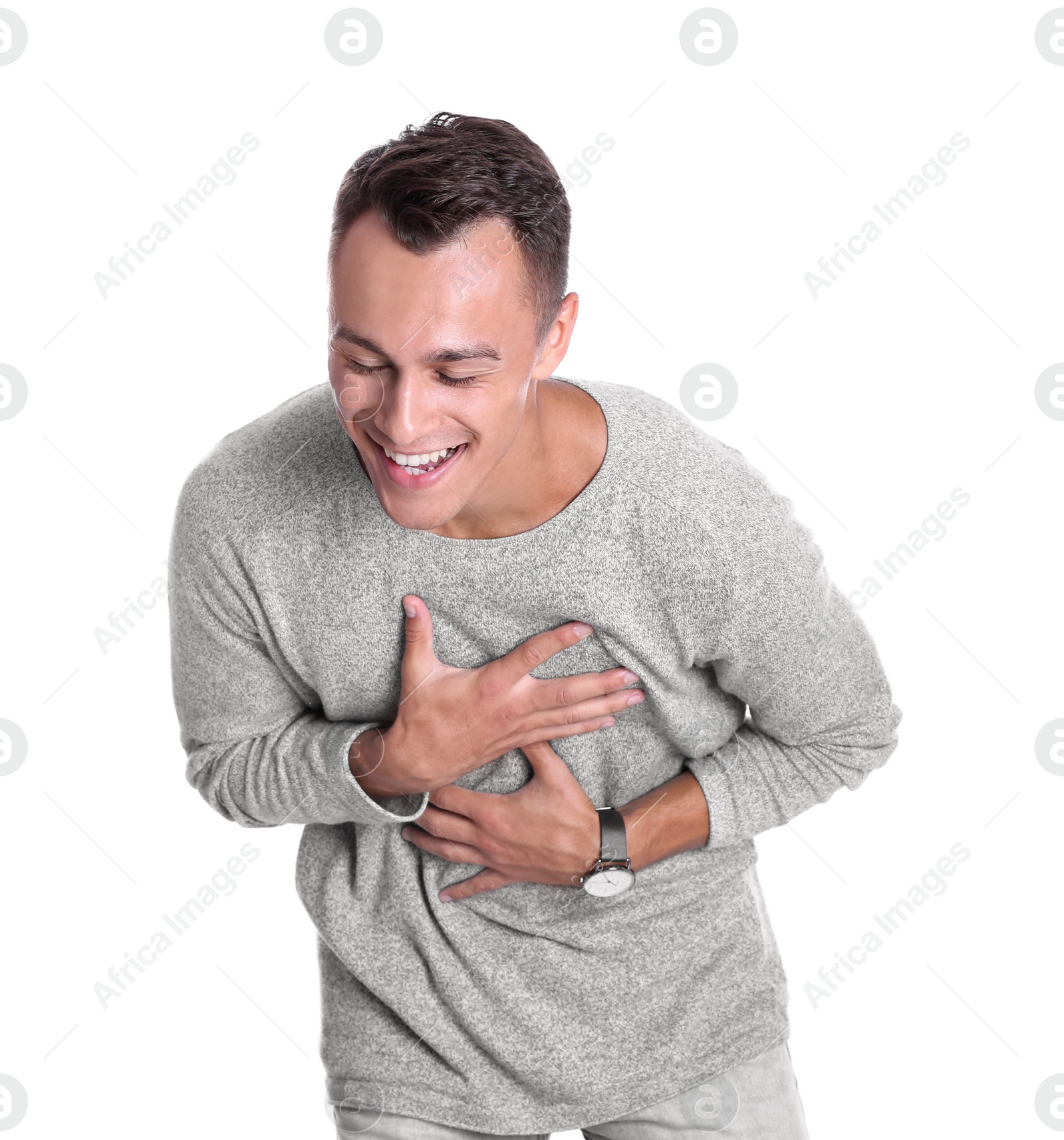 Photo of Portrait of handsome young man laughing on white background