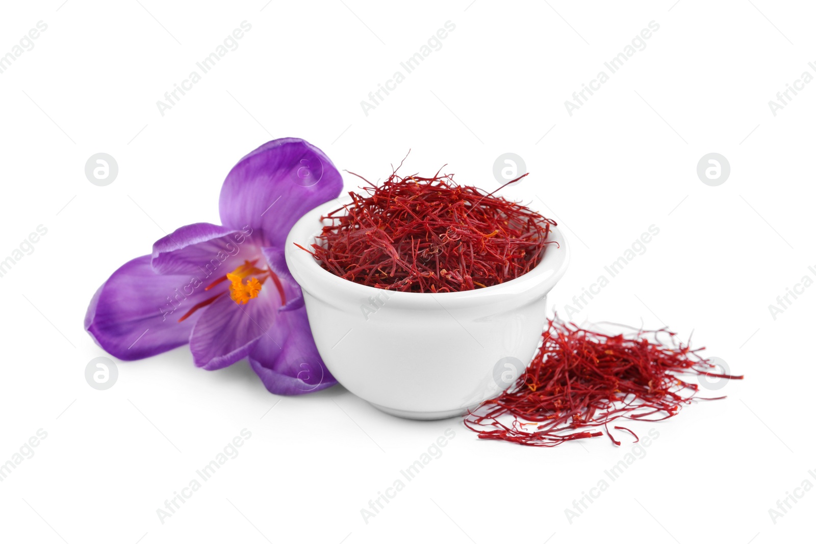 Photo of Dried saffron and crocus flower on white background