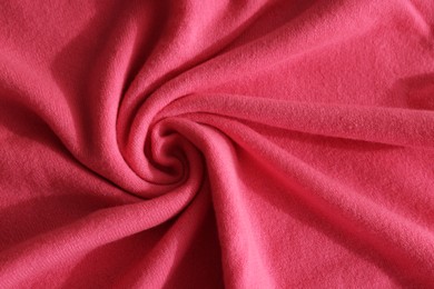 Photo of Beautiful pink fabric as background, top view