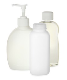 Bottles of baby cosmetic products on white background