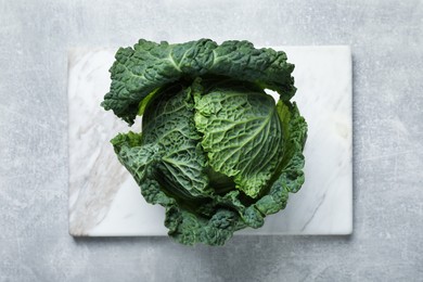 Fresh ripe savoy cabbage on grey table, top view