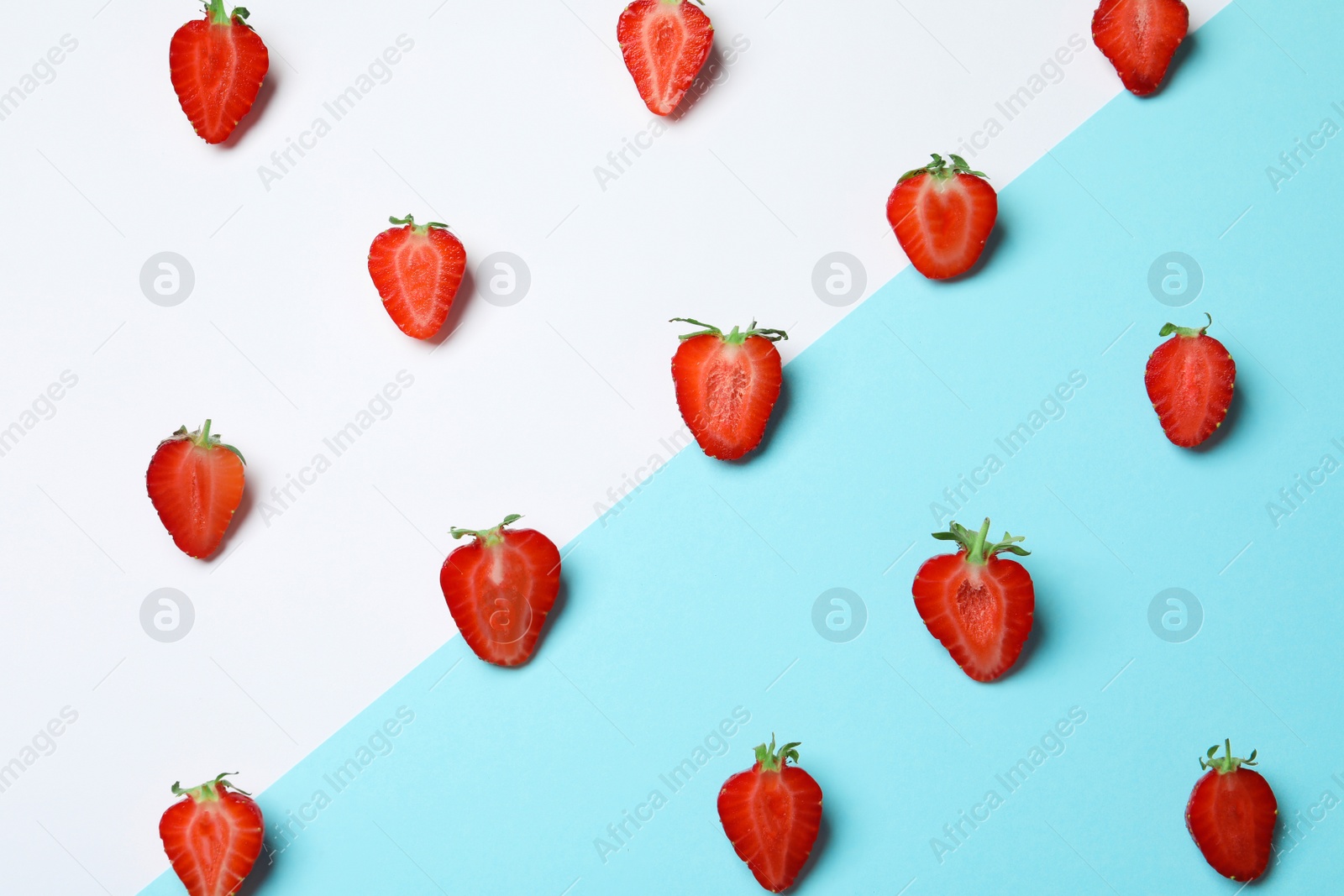 Photo of Flat lay composition with ripe strawberries on color background