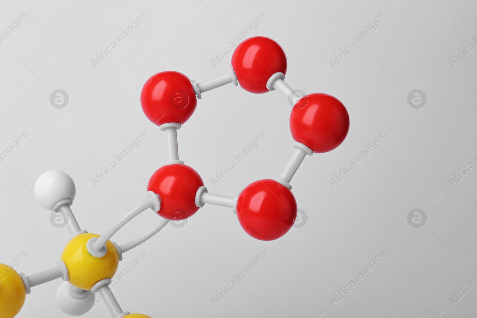 Photo of Structure of molecule on white background, closeup. Chemical model