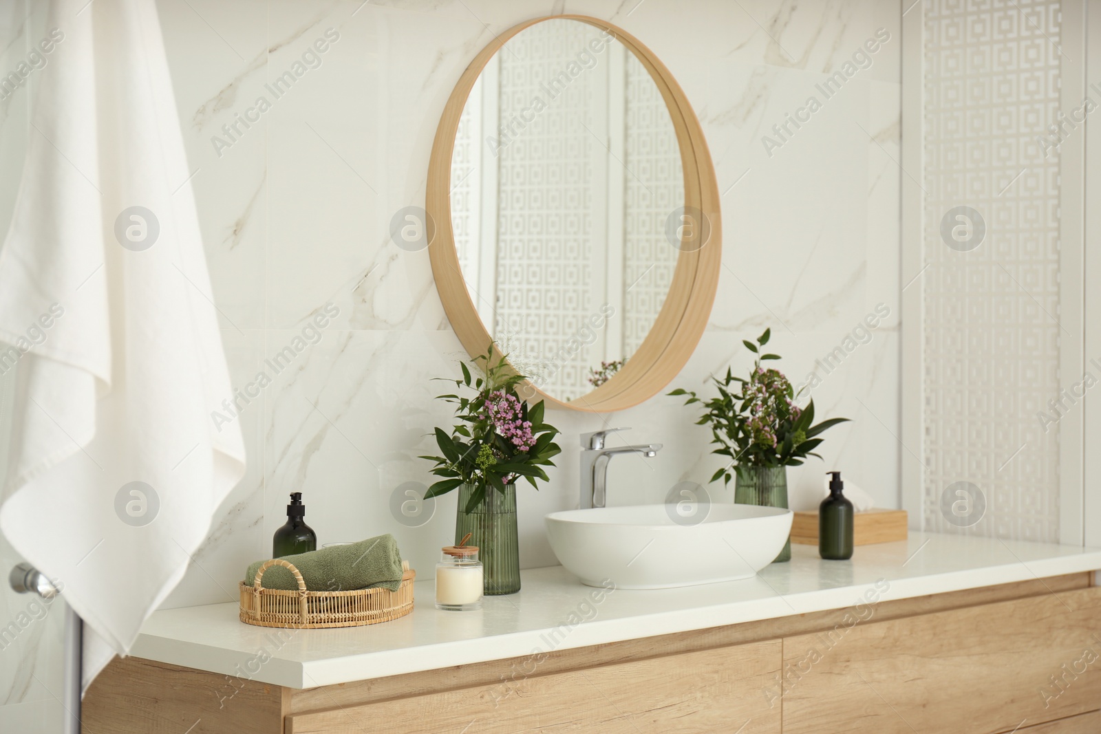 Photo of Modern bathroom interior with stylish mirror and vessel sink