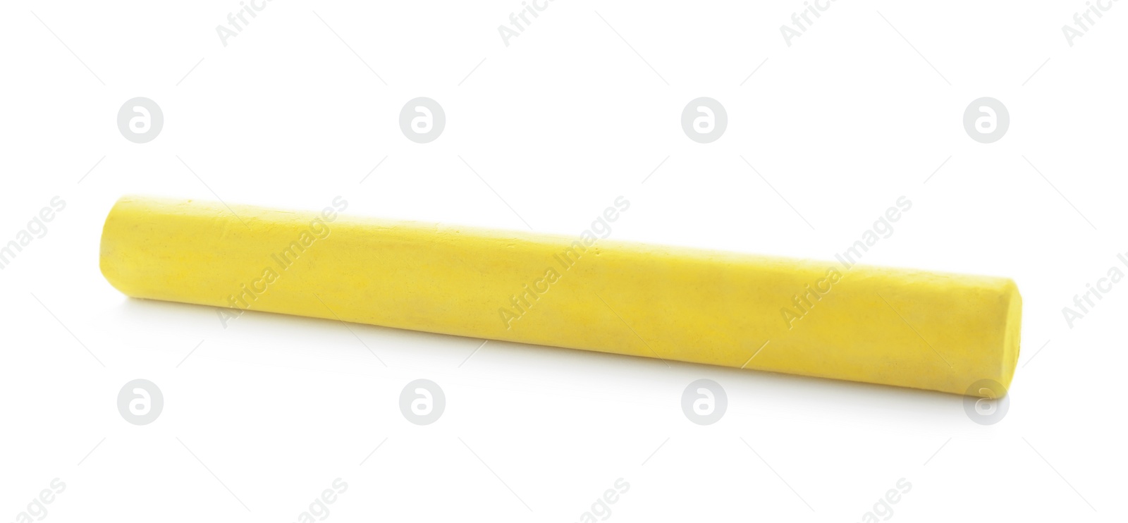 Photo of Piece of yellow chalk isolated on white