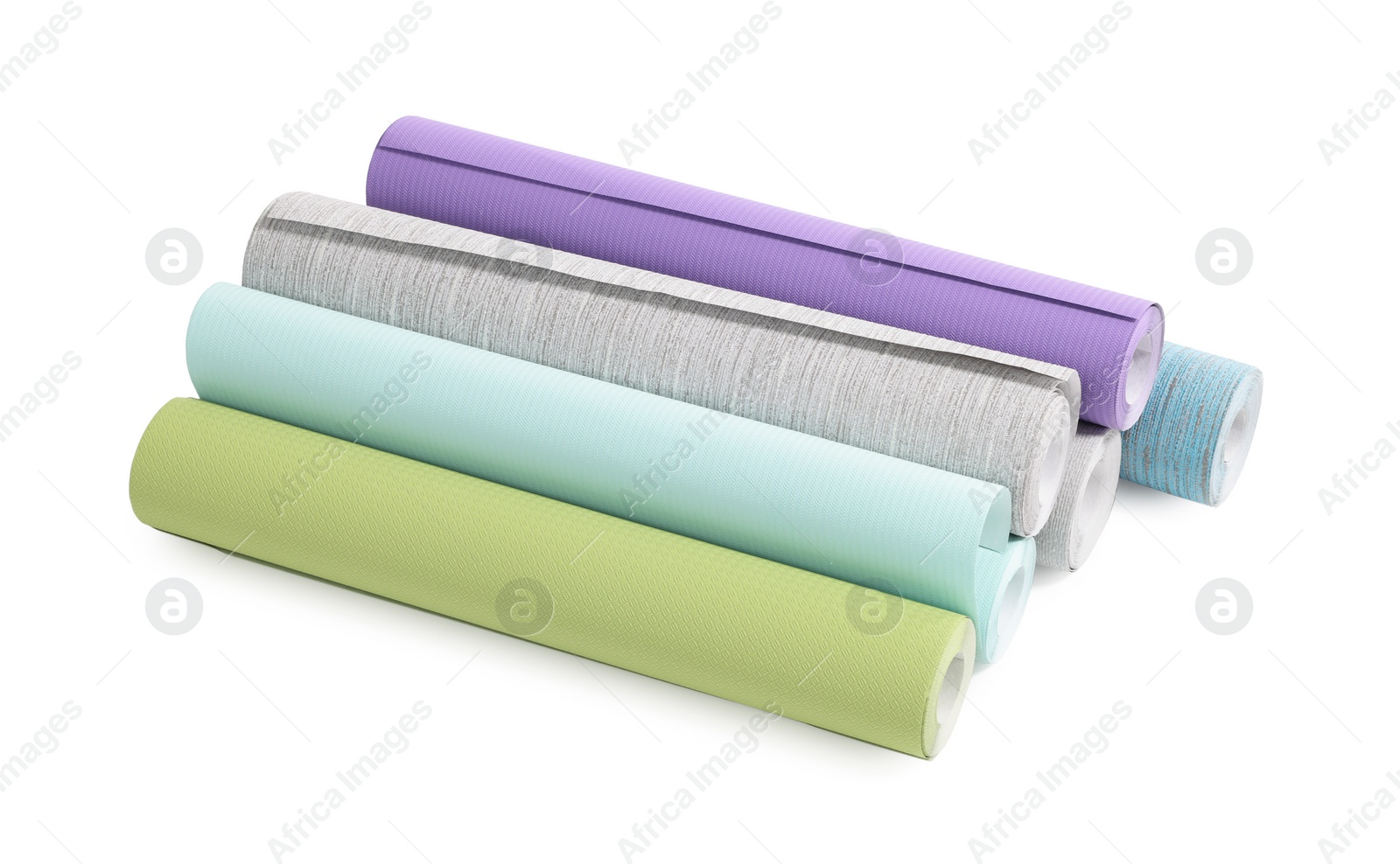 Photo of Many different wallpaper rolls isolated on white