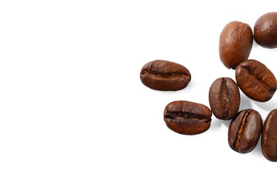 Many roasted coffee beans isolated on white , top view