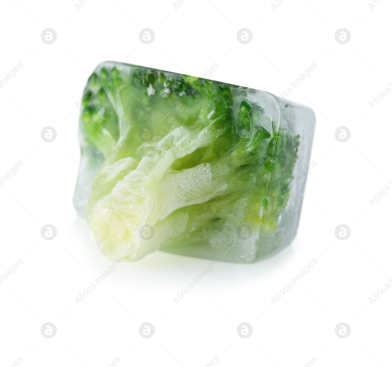 Photo of Fresh broccoli in ice cube on white background. Frozen vegetables