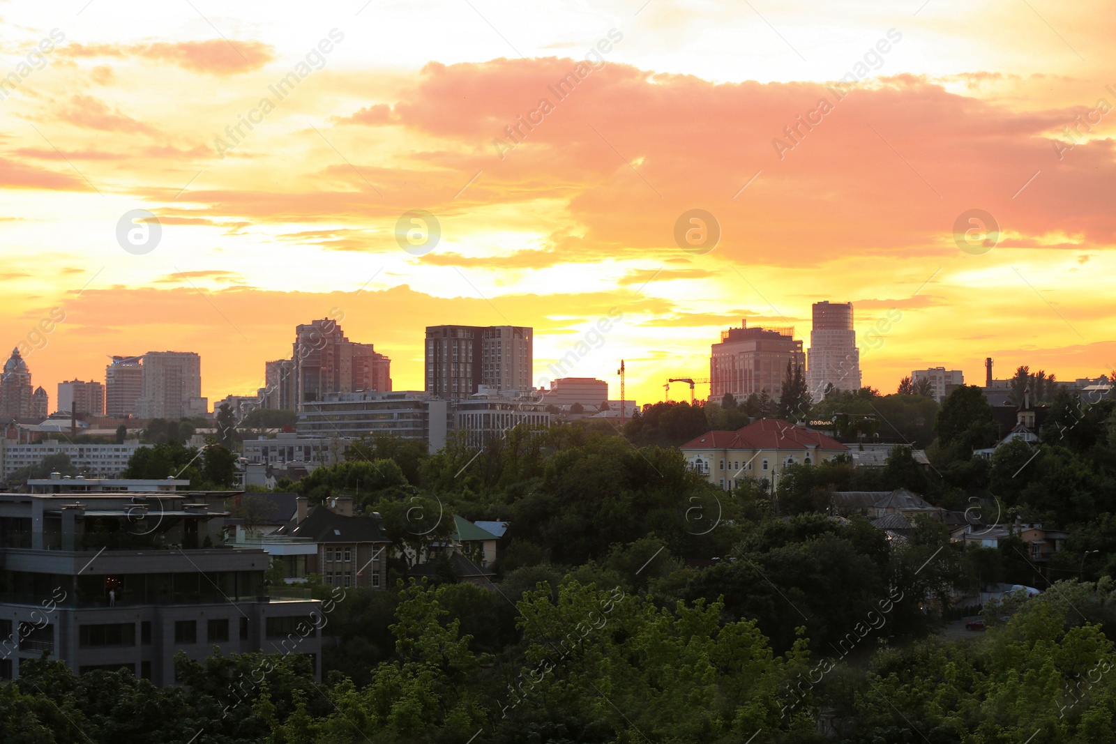 Photo of KYIV, UKRAINE - MAY 23, 2019: City district with modern buildings at sunset