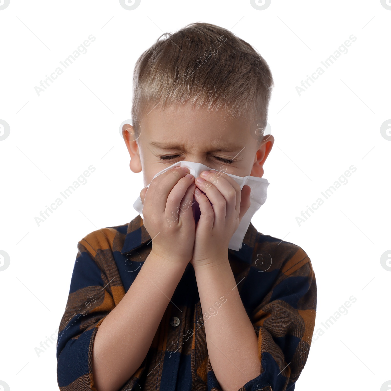 Photo of Sick boy with tissue coughing on white background. Cold symptoms