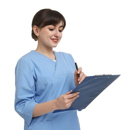 Portrait of smiling medical assistant with clipboard on white background