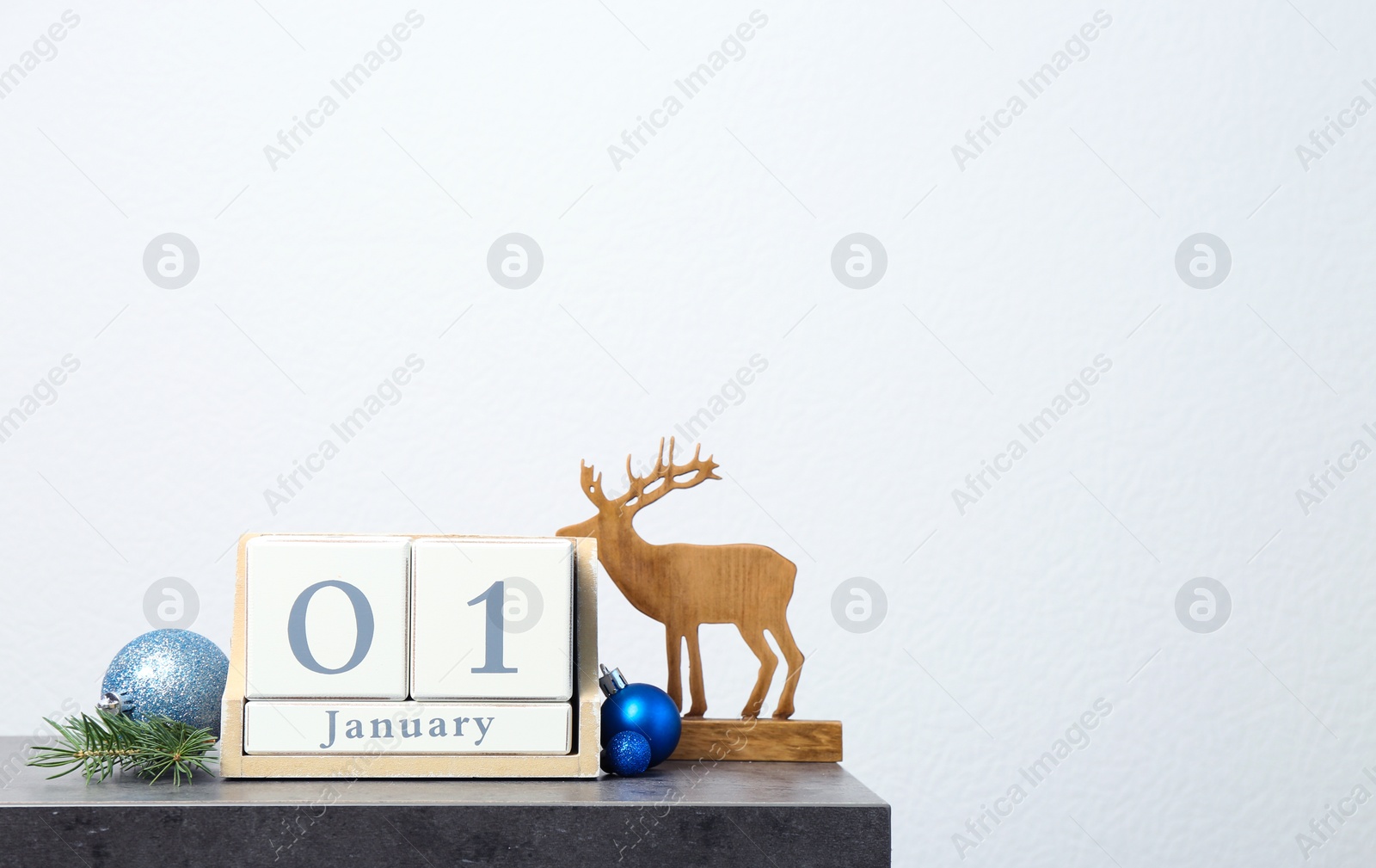 Photo of Wooden block calendar and festive decor on table. Christmas countdown