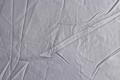 Photo of Crumpled grey fabric as background, top view