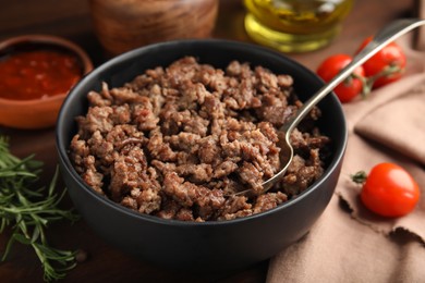 Photo of Fried minced meat and different products on wooden table, closeup