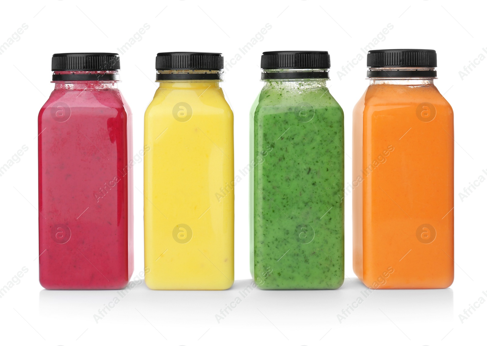 Photo of Bottles with delicious detox smoothies on white background