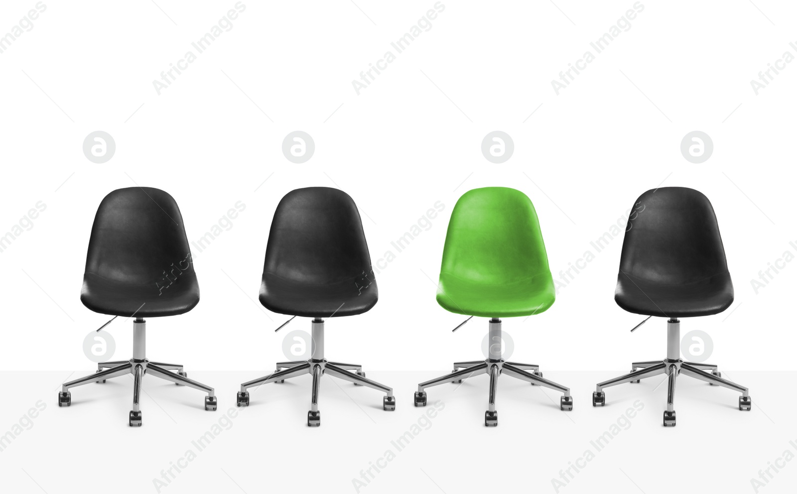 Image of Vacant position. Green office chair among black ones on white background