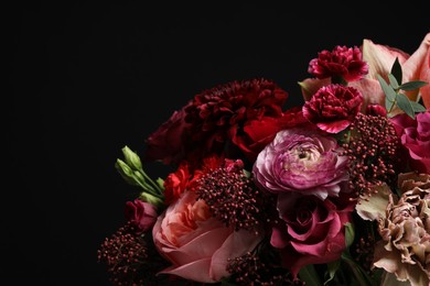 Photo of Beautiful fresh flowers on dark background, closeup