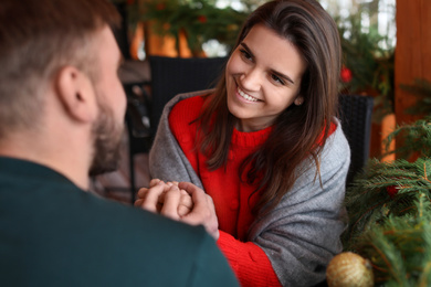 Romantic couple spending time together in cafe. Winter vacation