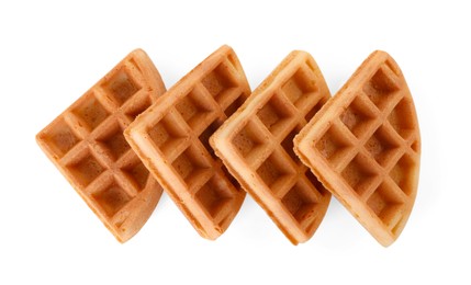 Photo of Many tasty Belgian waffles isolated on white, top view