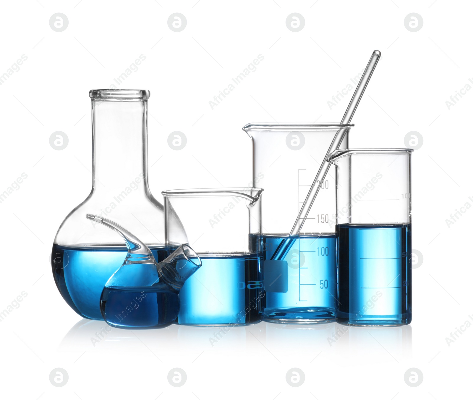 Photo of Set of laboratory glassware with blue liquid isolated on white