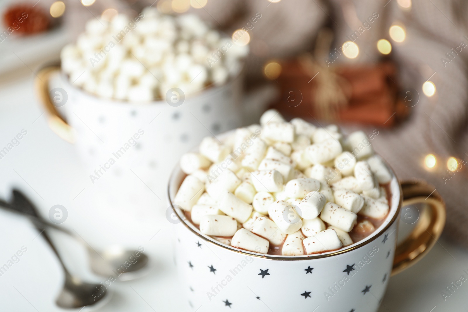 Photo of Delicious cocoa drink with marshmallows on table, closeup