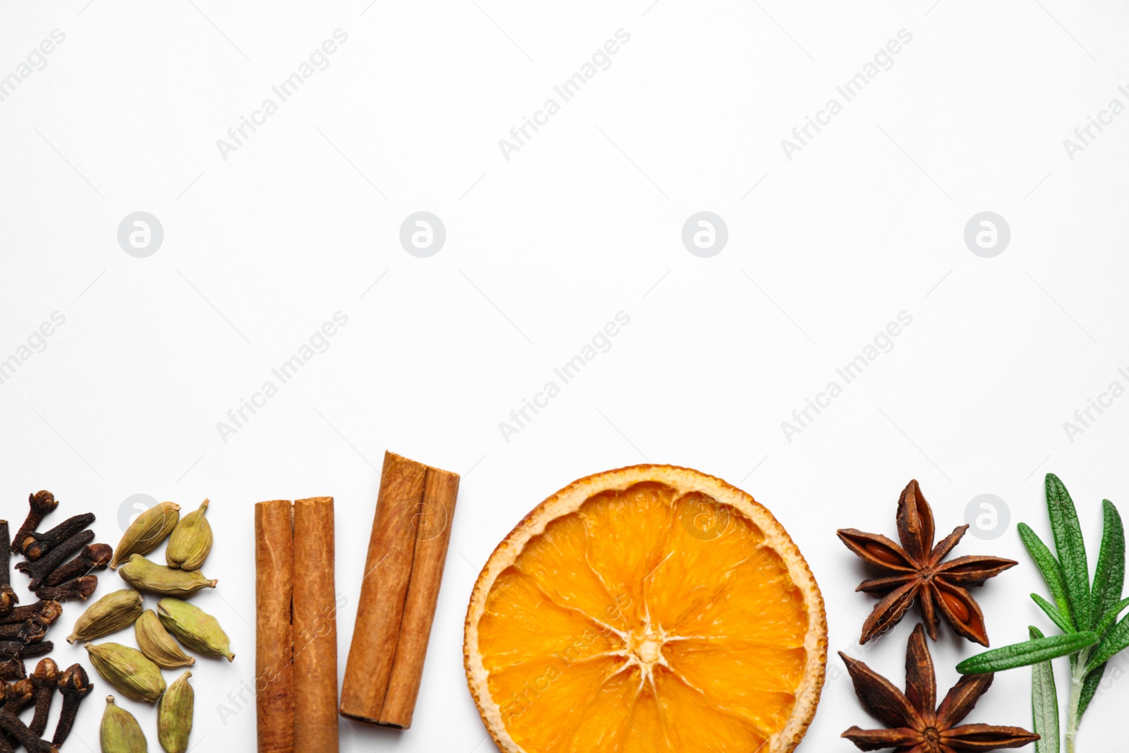 Photo of Different mulled wine ingredients on white background, flat lay. Space for text