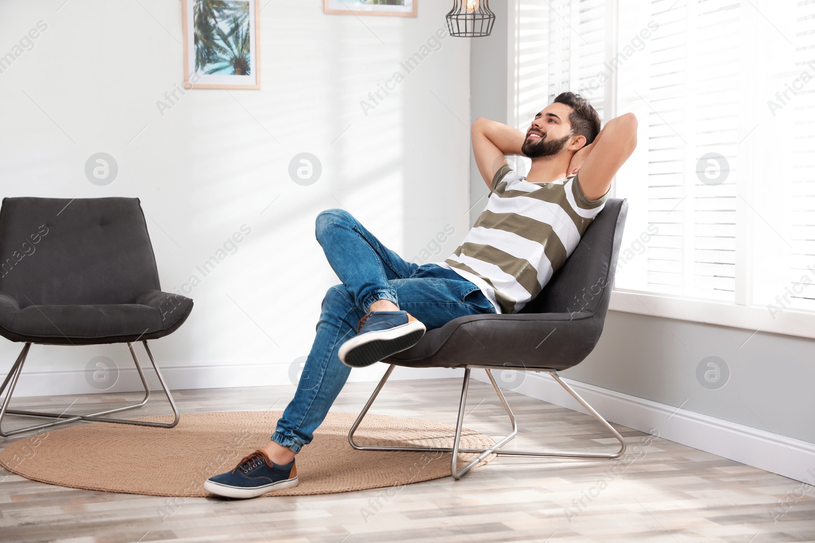 Photo of Young man relaxing at home. Peaceful rest